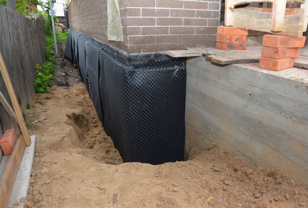 Happy homeowners after waterproofing job in Tonawanda